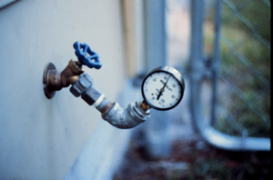 Pressure gauge on outside faucet.