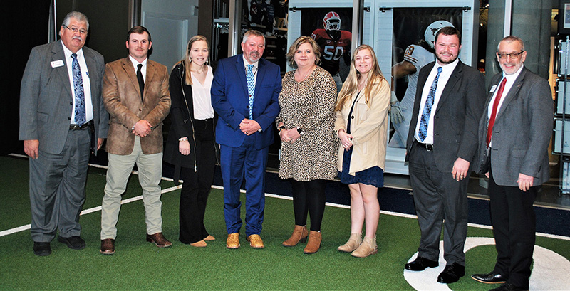 (Left to right) Mark McCann, Justin Pate, Christian Pate, Scotty Raines, Melanie Raines, Celie Raines, Guy Hancock, Nick Place.