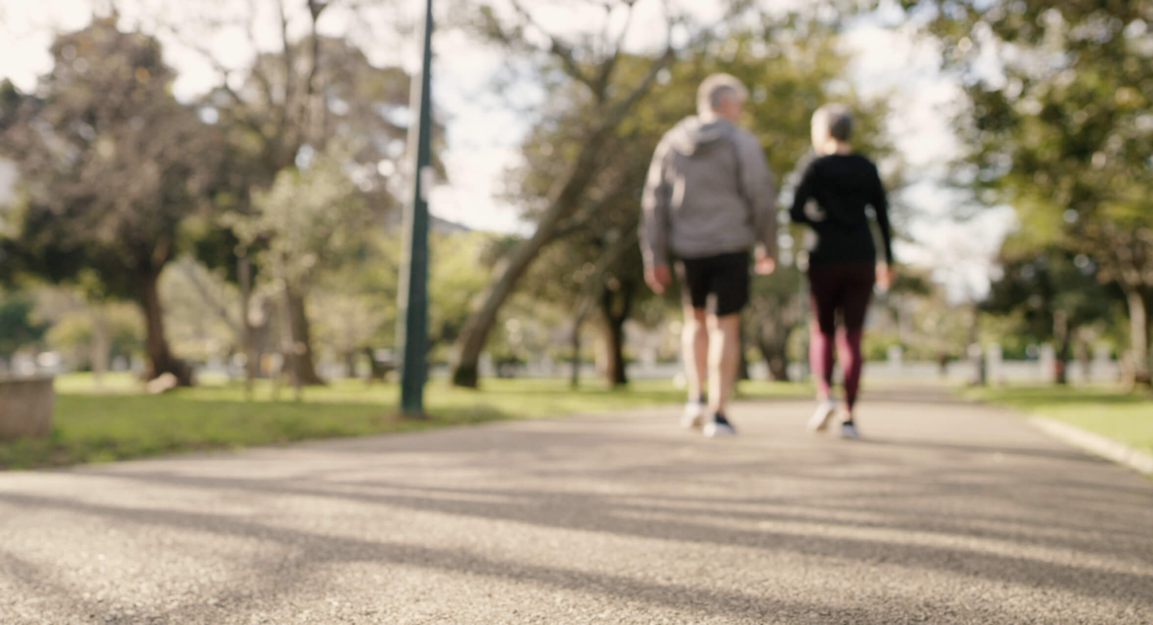 Rearview shot of a senior couple going for a walk in the park