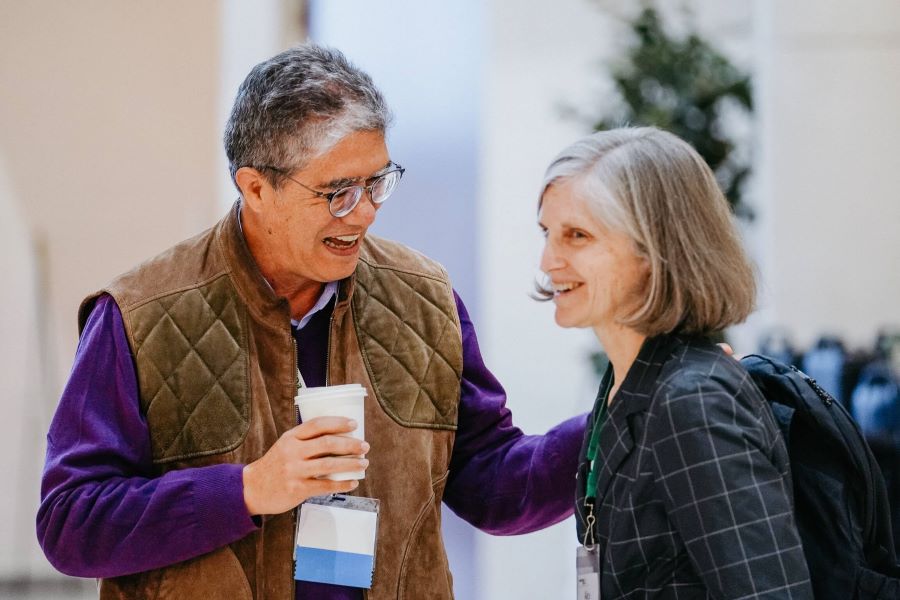 Juan Carlos Díaz-Pérez and Alice Rolls hug at the Georgia Organics conference in March 2023.