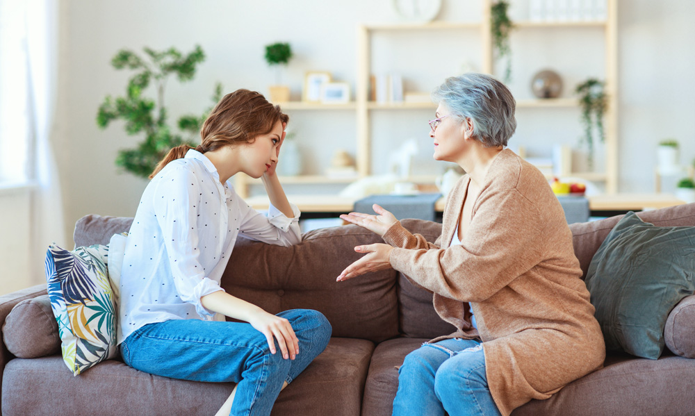 Grandparent having chat with grandchild
