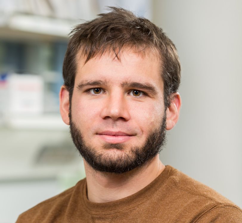 Headshot of Joseph Usack in his lab
