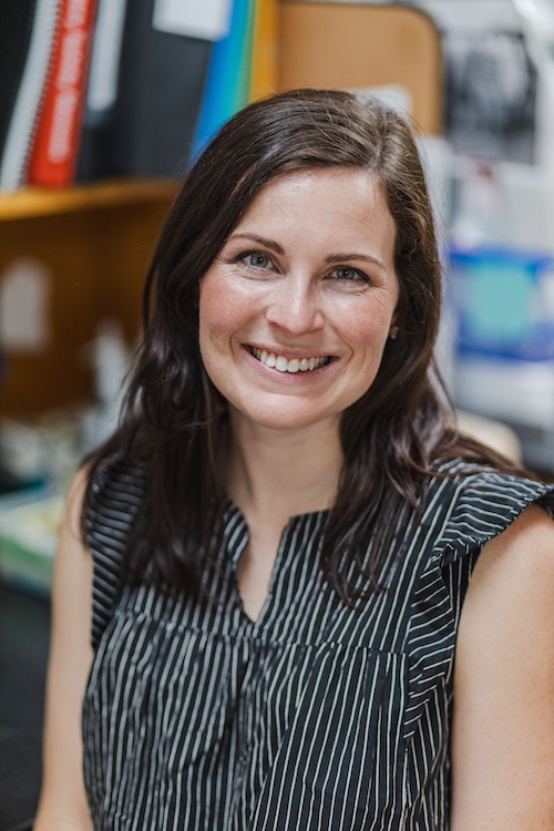 A headshot of Hallie Wright in a lab setting