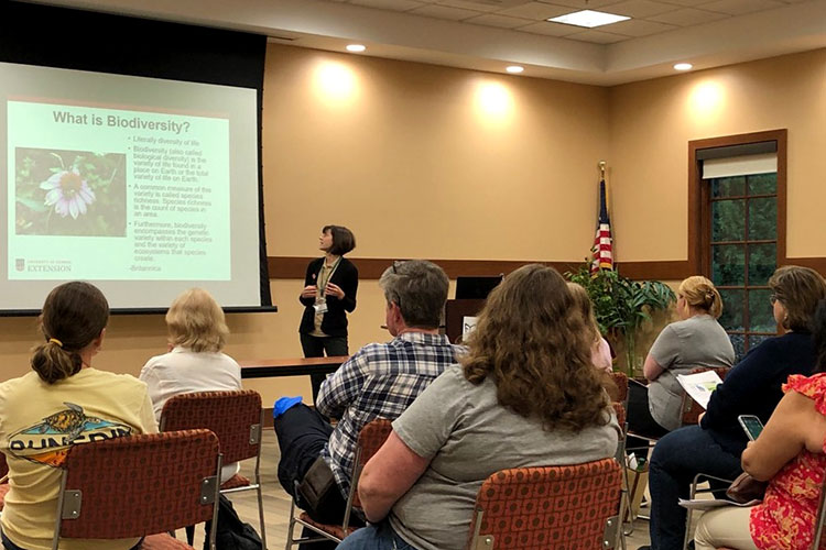 Forsyth County Master Gardener Extension Volunteer Cathy Bagdonis teaching county residents about biodiversity during a Georgia Green Landscape Stewards lecture at a county library.