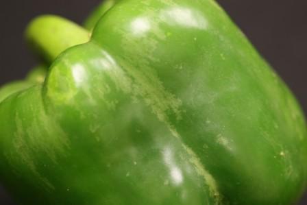 Closeup of a bell pepper showing light-colored areas of the skin